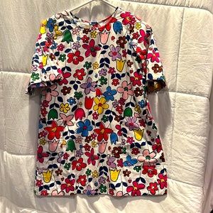 Bright floral dress with ruffle sleeves.